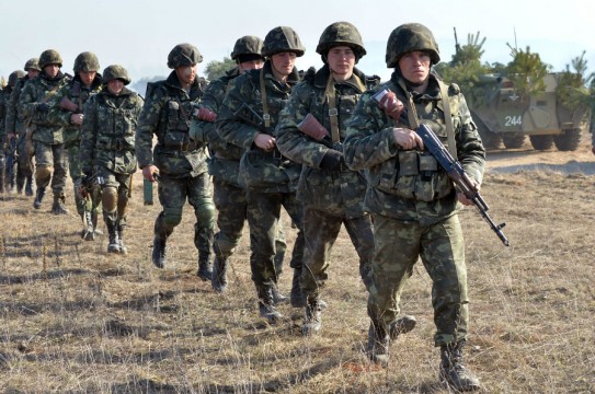 TOPSHOTS Ukrainian soldiers take part in a military drill not far from the small city of Goncharovskoye, some 150 km from Kiev, on March 14, 2014. Russia on March 14 declared it reserved the right to protect compatriots in the whole of Ukraine, seen as a threat that Moscow could move its forces beyond the Russian-speaking peninsula of Crimea.   AFP PHOTO / SERGEI SUPINSKYSERGEI SUPINSKY/AFP/Getty Images