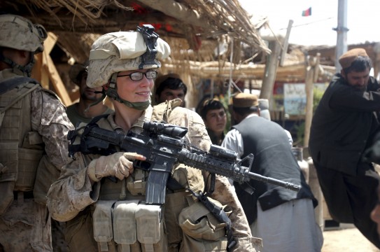 U.S. Marine Lance Cpl. Stephanie Robertson, a member of the female engagement team, speaks with local civilians during a 2010 engagement mission in Marjah, Afghanistan. For centuries men have formed a band of brothers as they faced the enemy on the field of battle, but now in the U.S., military women will soon be on the battlefield, too. (CNS photo/Lance Cpl. Marionne T. Mangrum, U.S. Marine Corps handout via Reuters) (Feb. 26, 2013) See COMBAT-WOMEN Feb. 26, 2013.